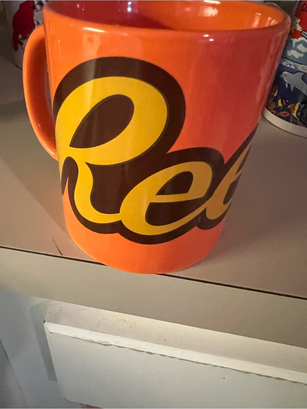Orange Ceramic Mug with Yellow Logo - Brand